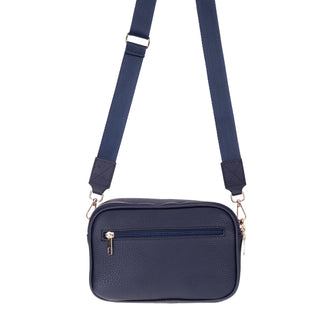 Navy blue crossbody bag with a strap on a white background