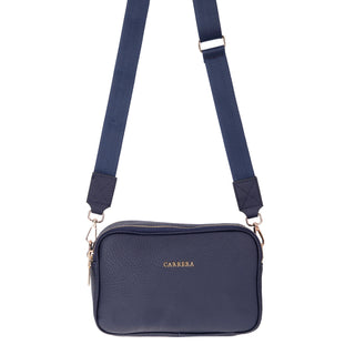 Navy blue handbag with a visible brand logo on a white background