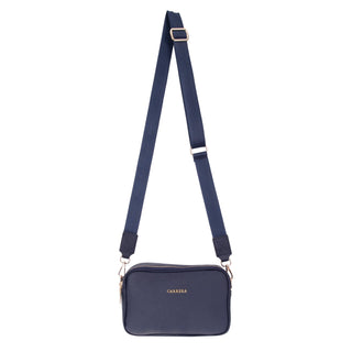 Navy blue crossbody bag with a strap on a white background