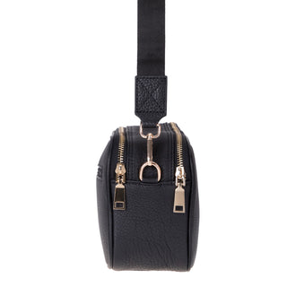 Black leather crossbody bag with gold zipper details on a white background